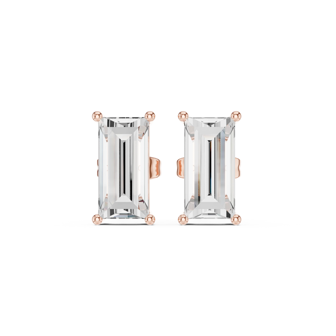 Pair of emerald-cut gemstone earrings with rose gold settings on a white background