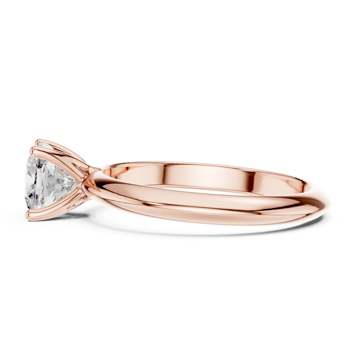 Side view of rose gold cushion cut diamond solitaire ring, highlighting design profile.