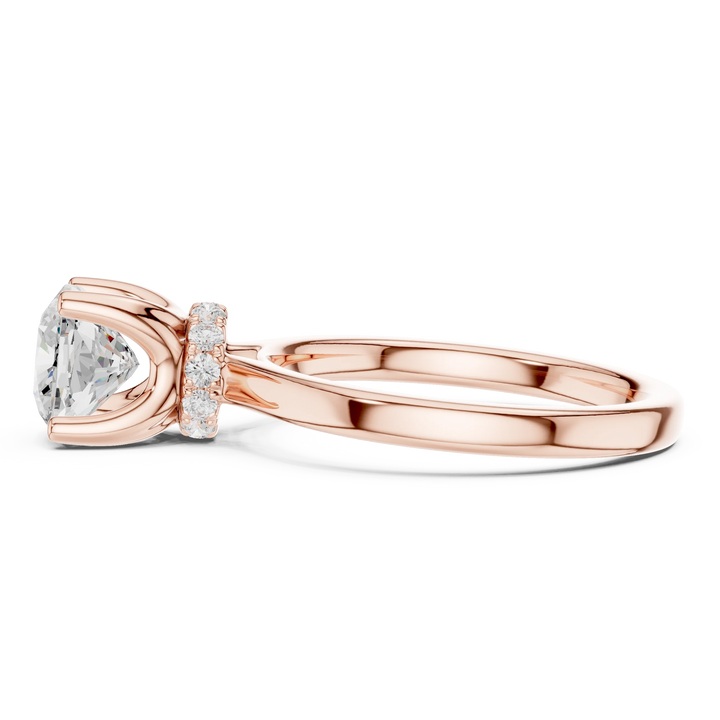 Side view of rose gold cushion cut solitaire ring highlighting hidden halo and domed band design