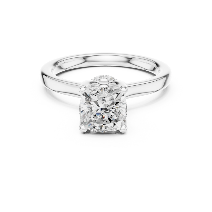 White gold cushion cut solitaire ring with hidden halo and domed band featuring lab-grown diamond, elegant design