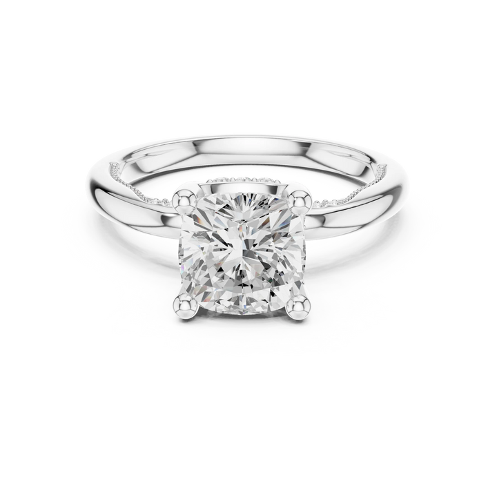 White gold cushion cut solitaire ring with hidden halo and domed band featuring lab-grown diamond, elegant design
