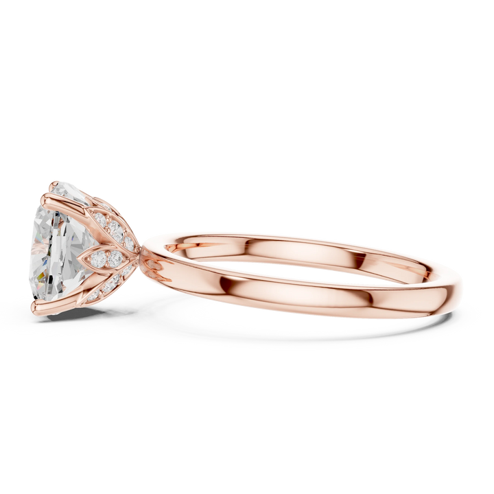 Side profile of rose gold cushion cut solitaire ring with domed band and elevated center stone