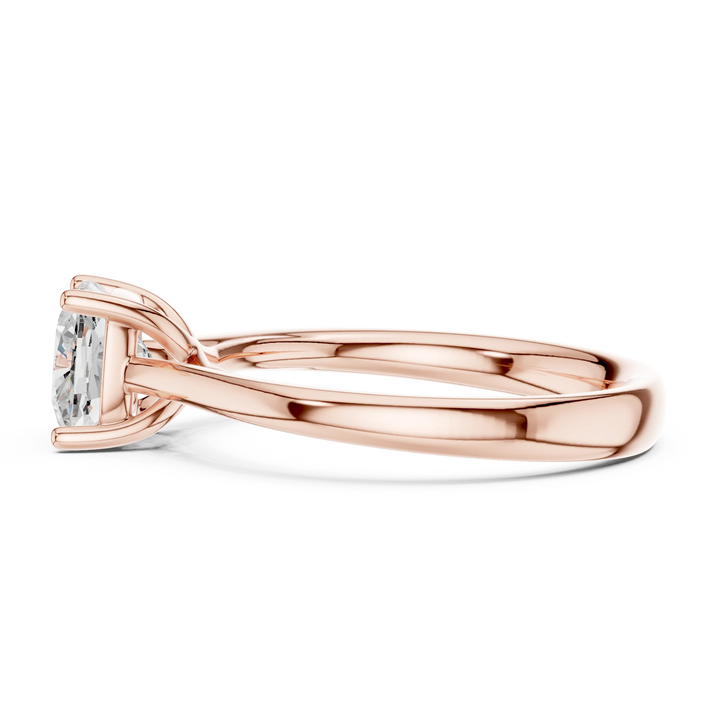 Side view of rose gold cushion cut solitaire ring highlighting setting and band structure