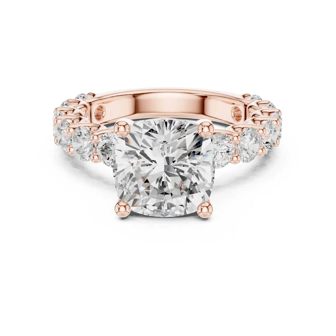 Lab-grown cushion cut solitaire ring in rose gold with shared prong large stone band