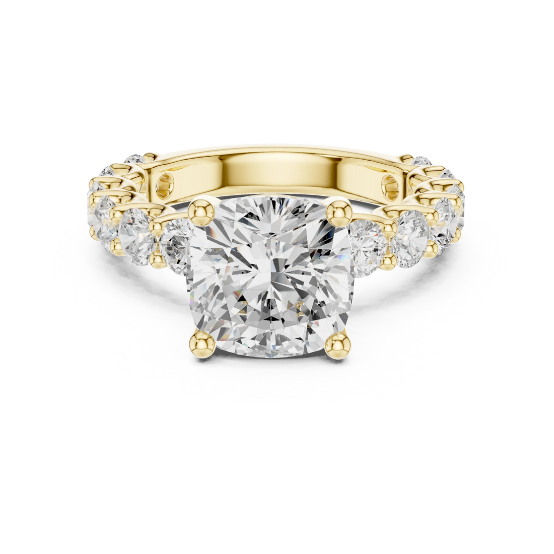 Lab-grown cushion cut solitaire ring in yellow gold with shared prong large stone band