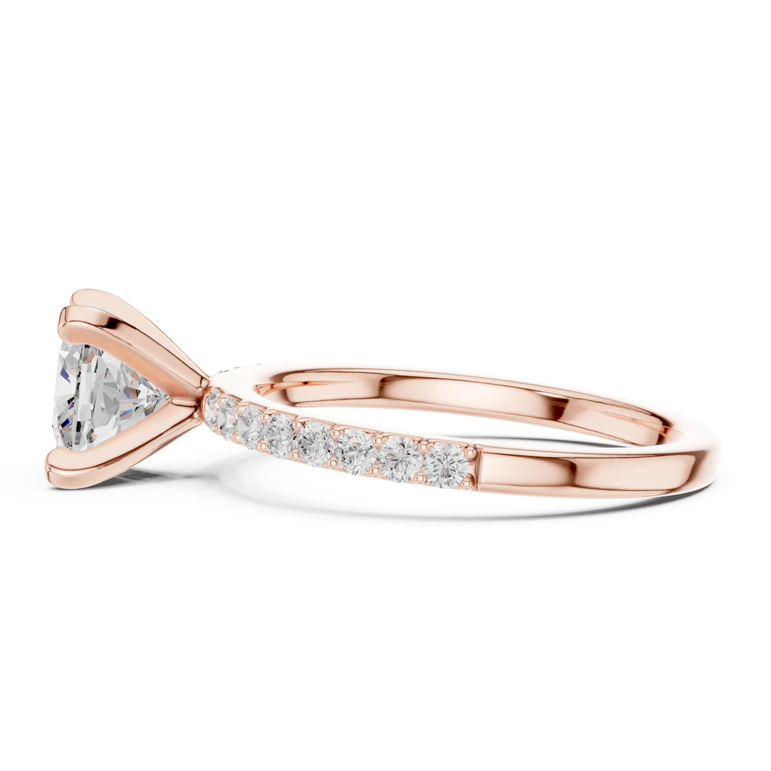 Side profile of rose gold cushion solitaire ring with thin pavé band and elevated setting