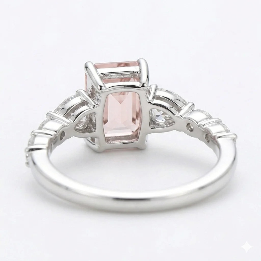 Back view of white gold emerald cut center stone ring with trillion side stones and lab-grown diamonds – Australia