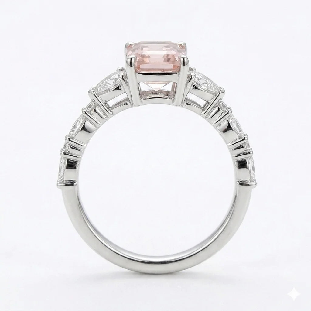 Side view of white gold emerald cut center stone ring with trillion side stones and lab-grown diamonds – Australia
