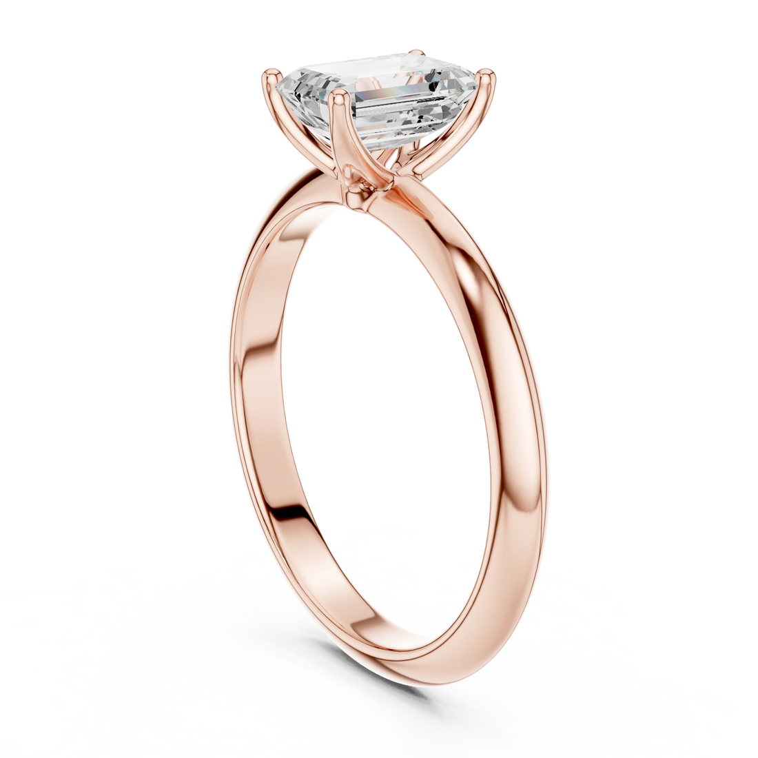 Back view of rose gold emerald diamond solitaire ring, showing band and setting detail