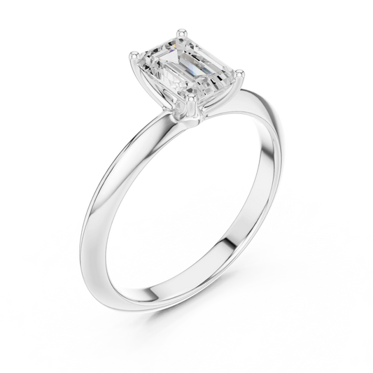 Front view of white gold emerald cut diamond solitaire ring, showcasing center stone