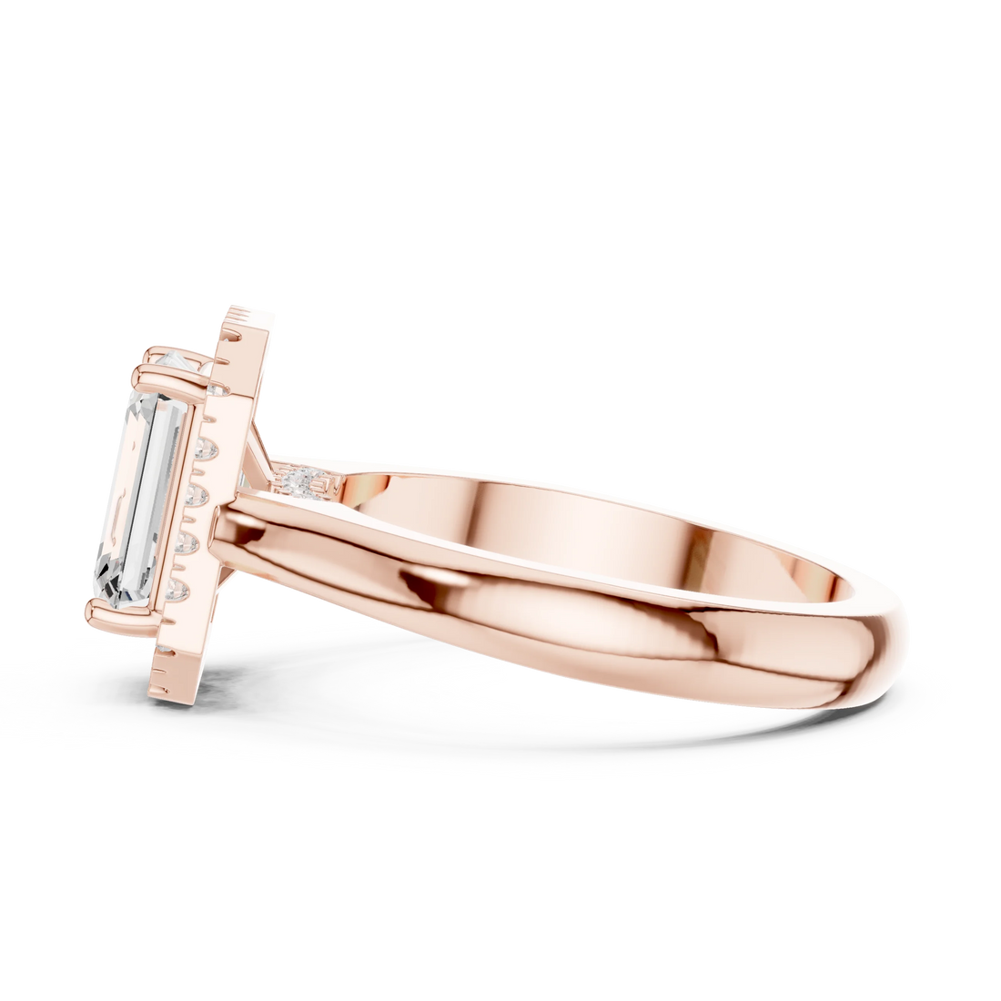 Side view of rose gold emerald halo ring highlighting diamond setting and band profile