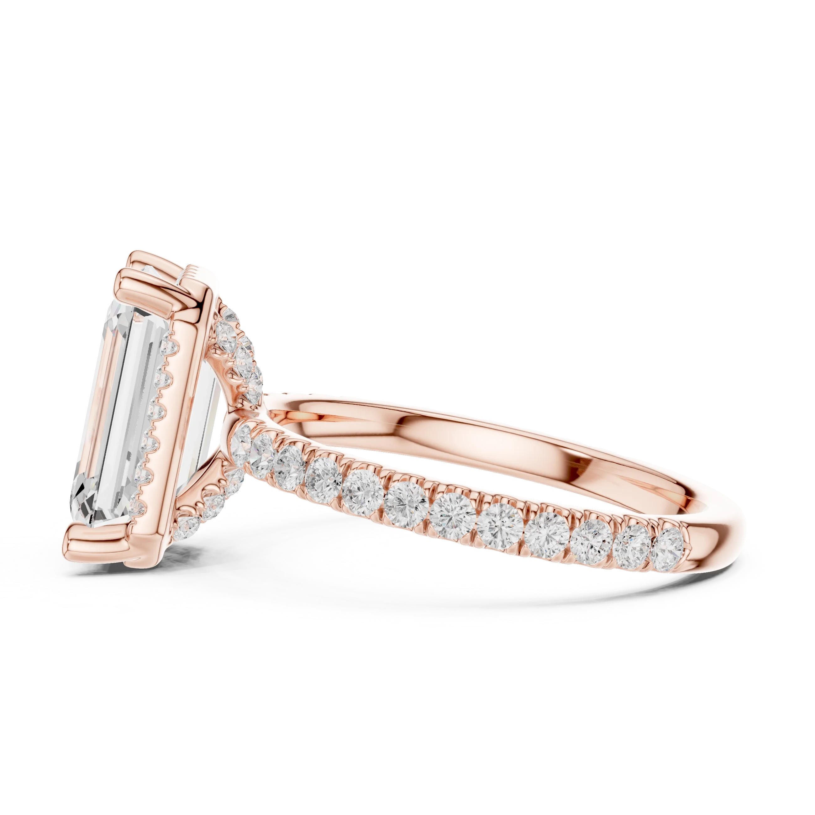 Side view of rose gold emerald cut solitaire ring highlighting hidden halo and thin pavé band design
