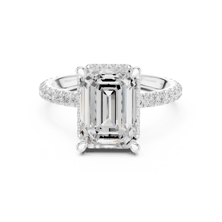 White gold emerald cut solitaire ring with hidden halo and thin pavé band featuring lab-grown diamond, elegant design