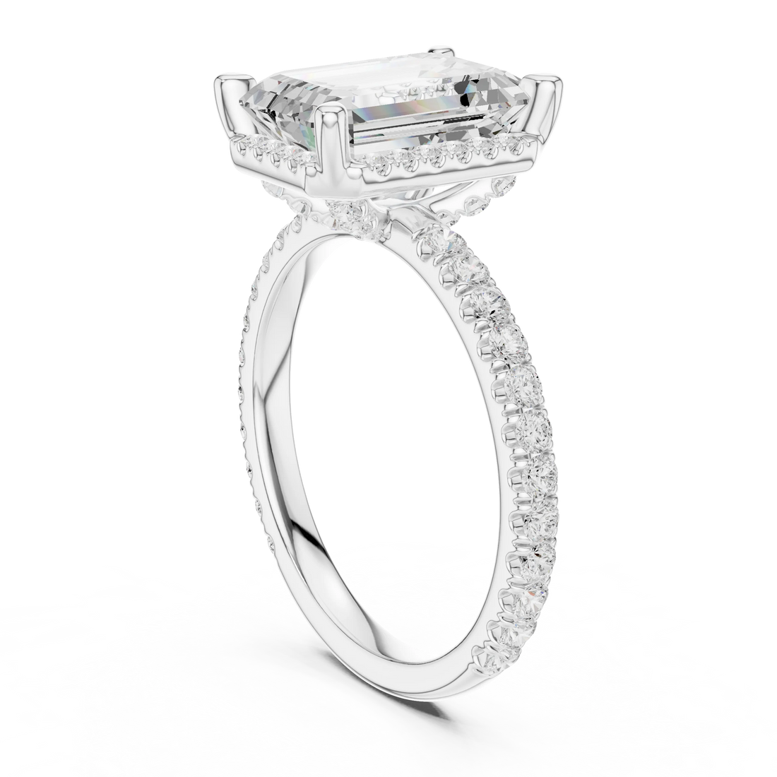 Back side view of white gold emerald cut solitaire ring showing hidden halo and thin pavé band details