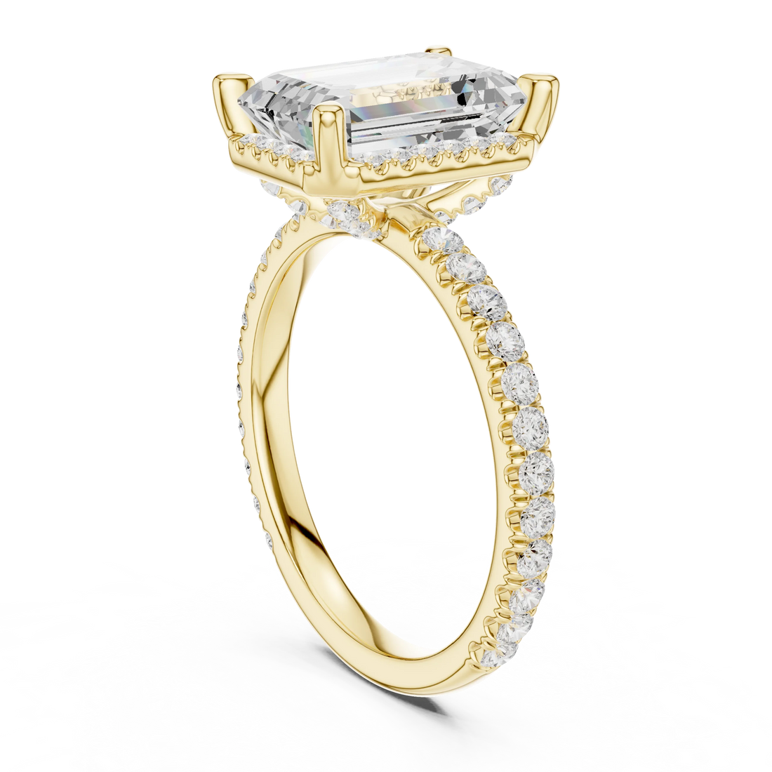 Back side view of yellow gold emerald cut solitaire ring showing hidden halo and thin pavé band details