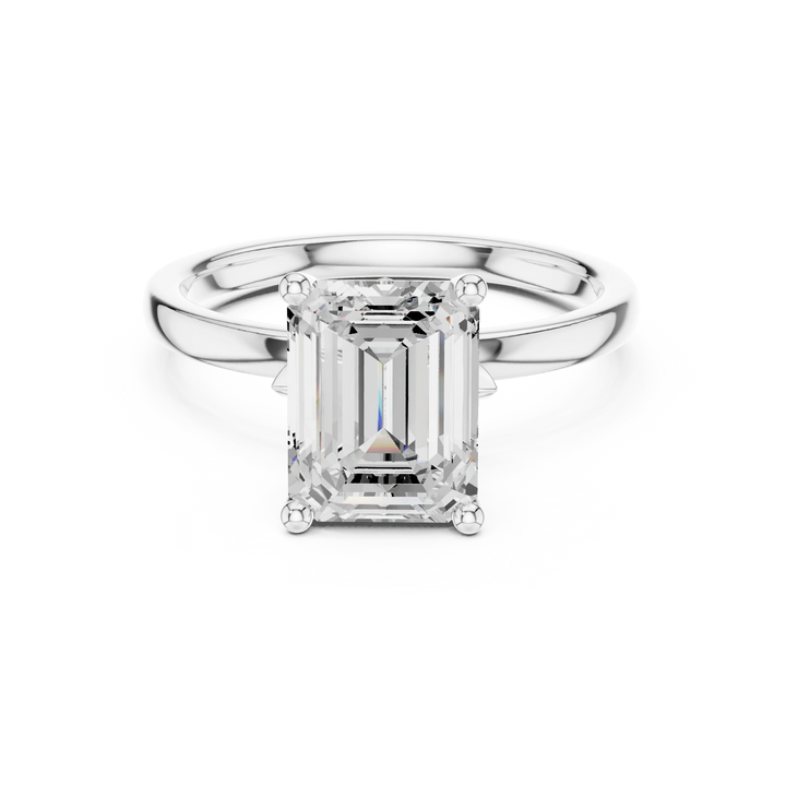 Lab-grown emerald cut solitaire ring in white gold with plain domed band
