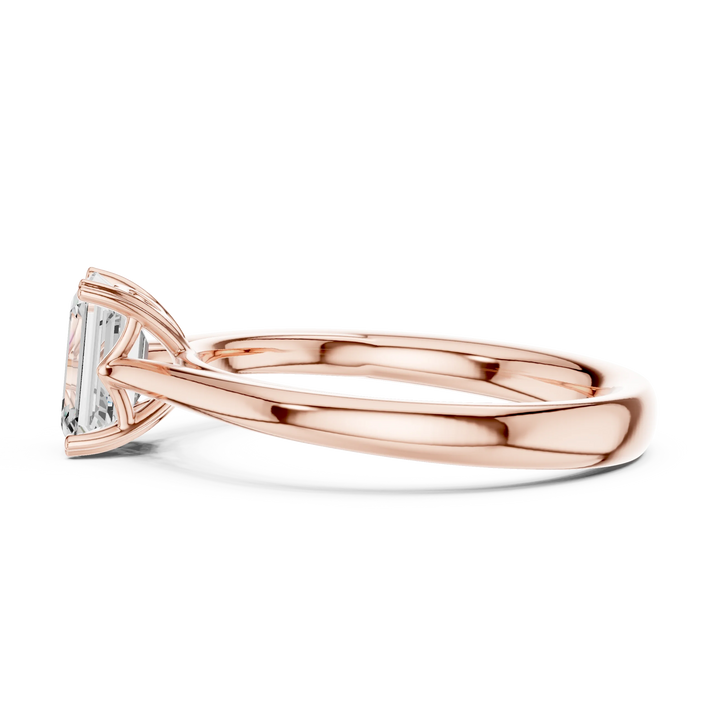 Side view of rose gold emerald solitaire ring with lab-grown emerald highlighting setting design