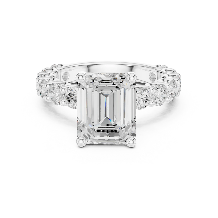 Lab-grown emerald cut solitaire ring in white gold with shared prong large stone band