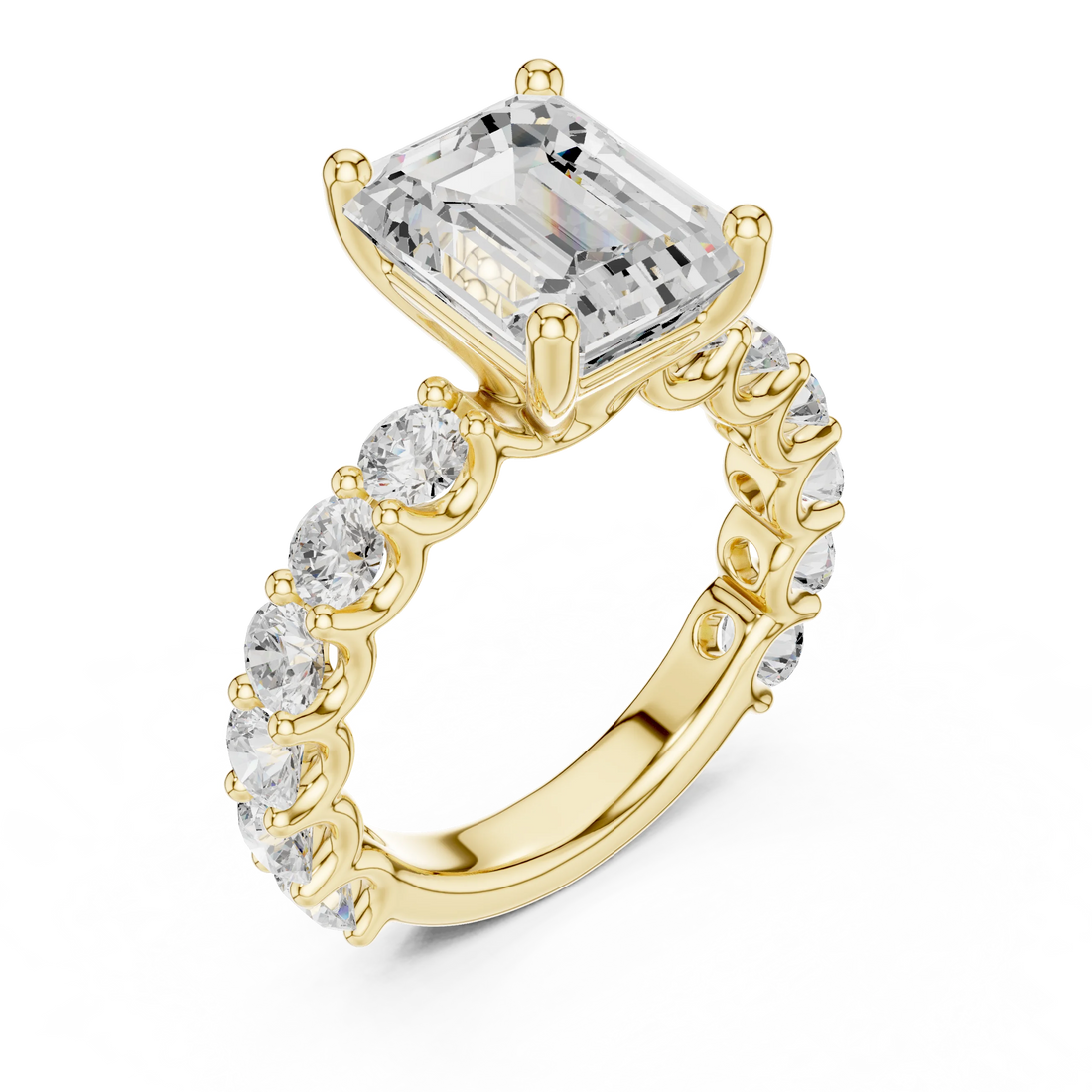 Front view of yellow gold emerald cut solitaire ring with shared prong large stone band and center gemstone