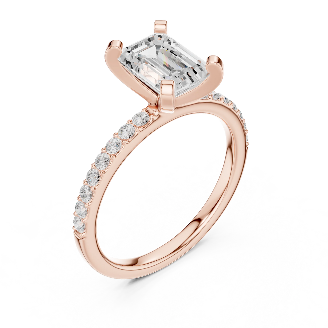 Front view of rose gold emerald solitaire ring with thin pavé band and center diamond