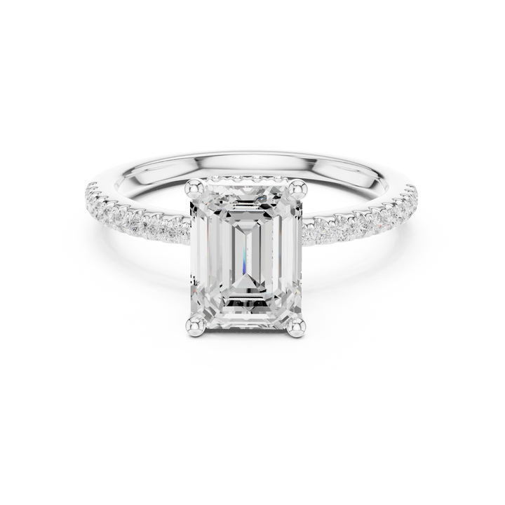 White gold emerald cut solitaire ring with thin pave band and lab-grown diamond, sleek elegant design