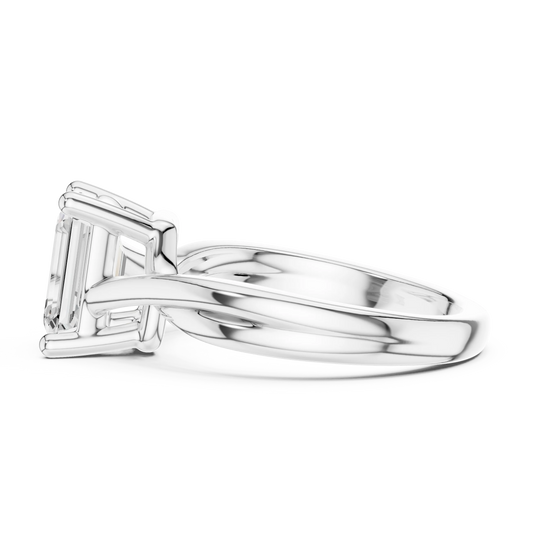 Side view of white gold emerald cut solitaire ring with twisted band and raised setting