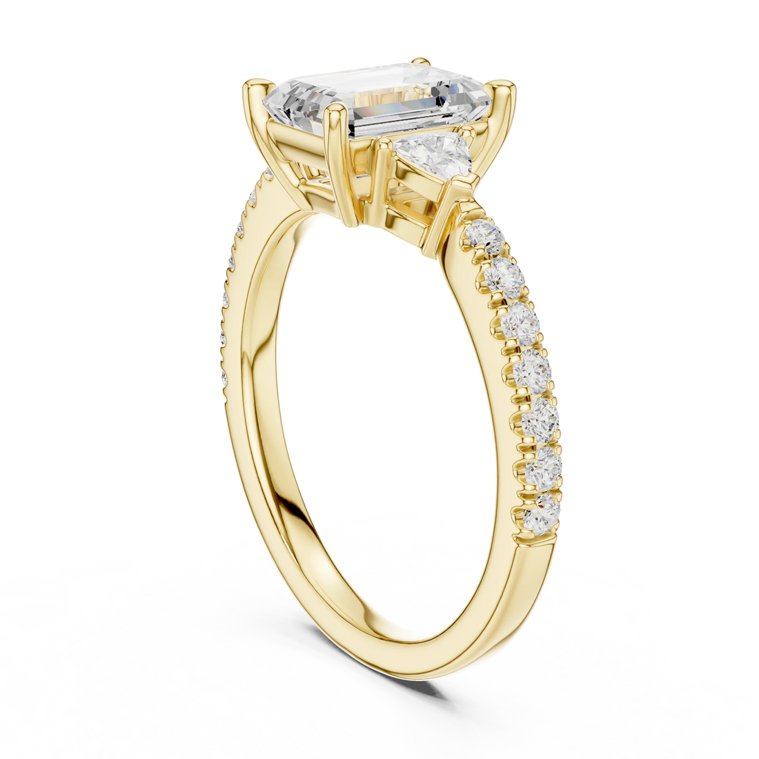Back side view of yellow gold emerald three stone diamond pave ring, showing band structure.
