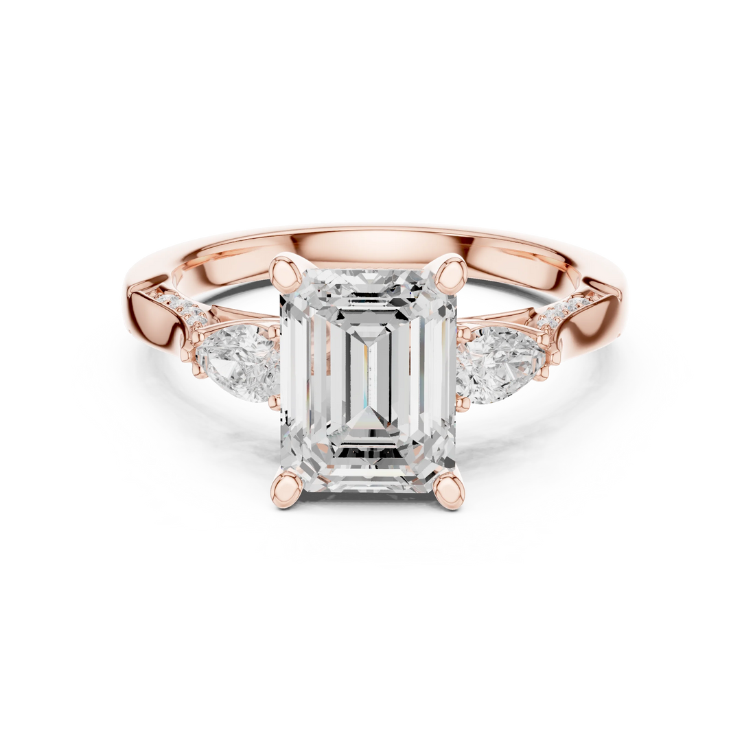 Emerald three stone ring in rose gold with pear side stones, accent band and lab-grown diamonds – Australia