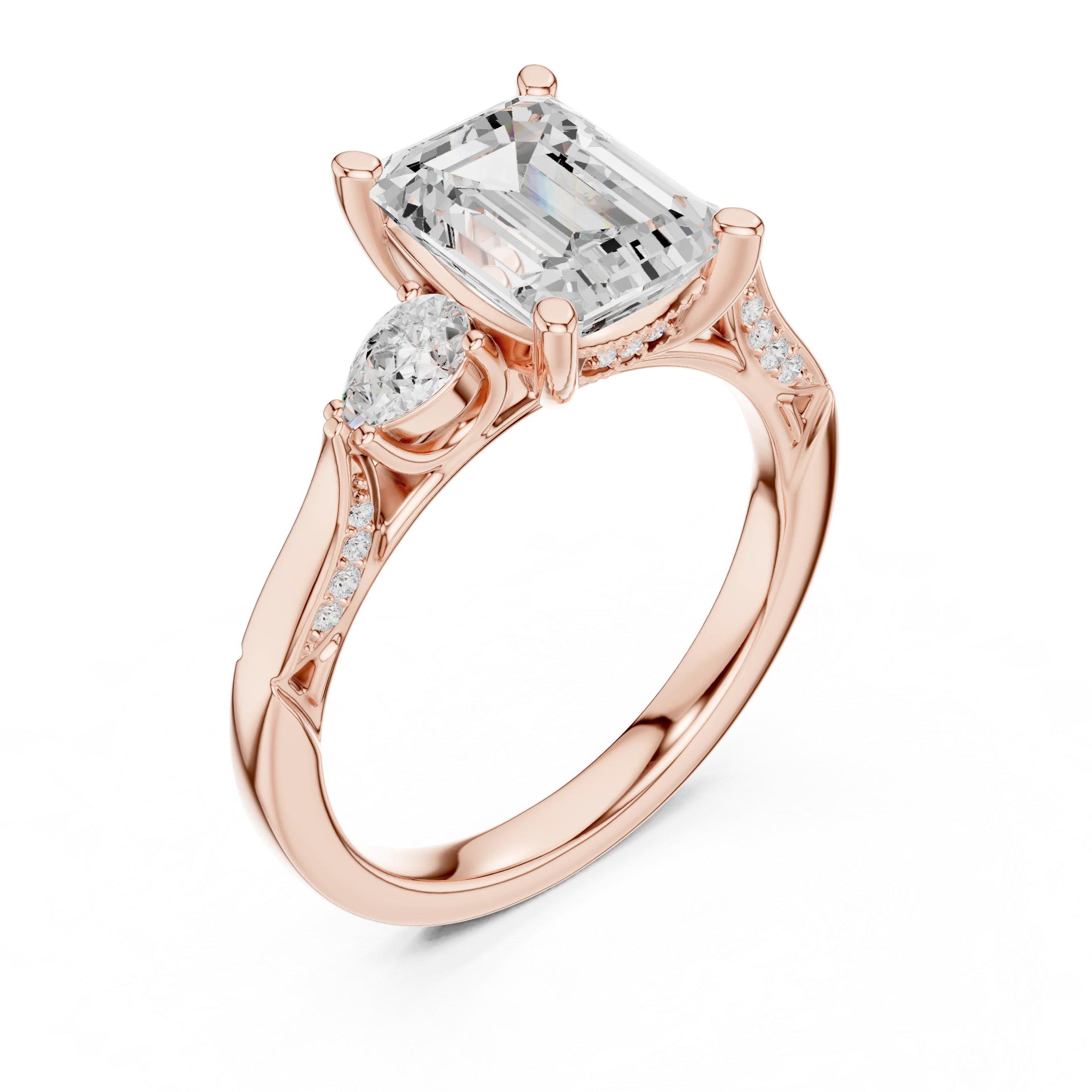 Front view of rose gold emerald three stone ring with pear side stones, accent band and lab-grown diamonds – Australia