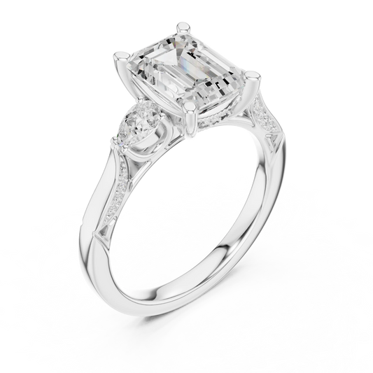 Front view of white gold emerald three stone ring with pear side stones, accent band and lab-grown diamonds – Australia