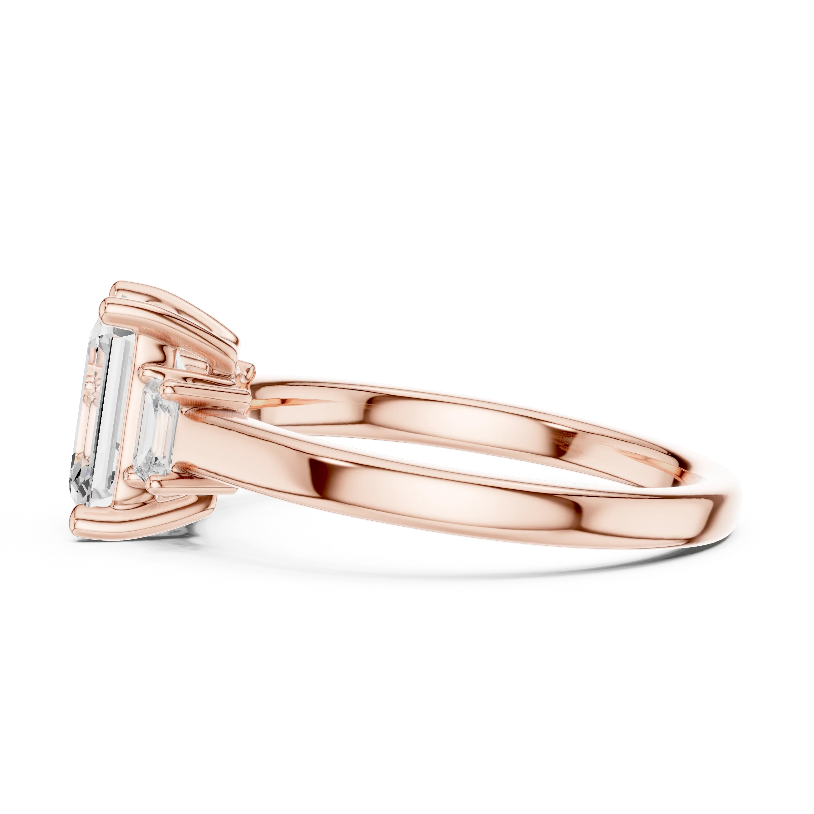 Side view of rose gold emerald cut three stone diamond ring, highlighting design profile.