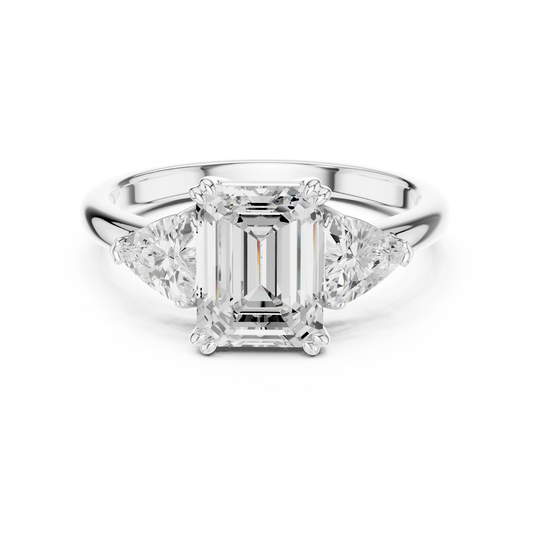 Emerald three-stone ring in white gold with trillion cut side stones and lab-grown diamond – Australia