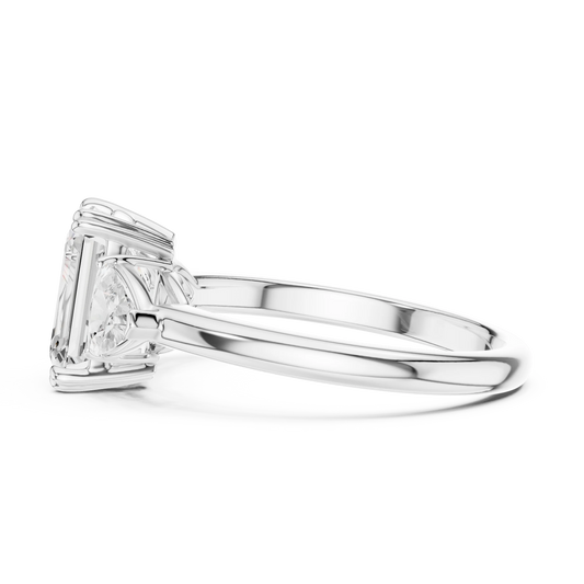 Side view of white gold emerald three-stone ring with trillion cut side stones and lab-grown diamond – Australia