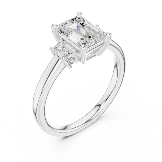 Front view of white gold emerald cut three stone diamond ring, showcasing center and side stones.