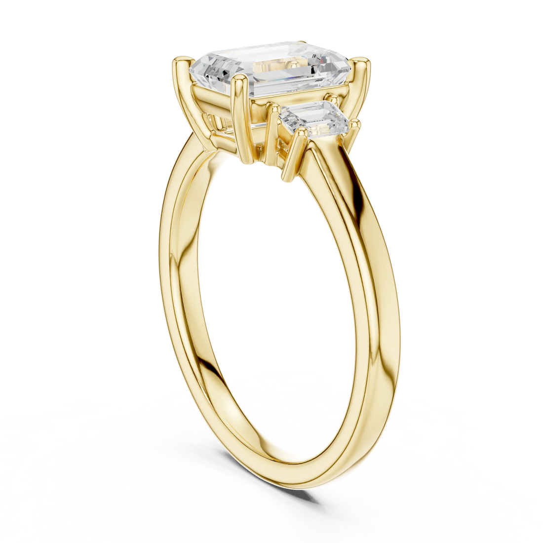 Back side view of yellow gold emerald three stone diamond ring, showing band structure