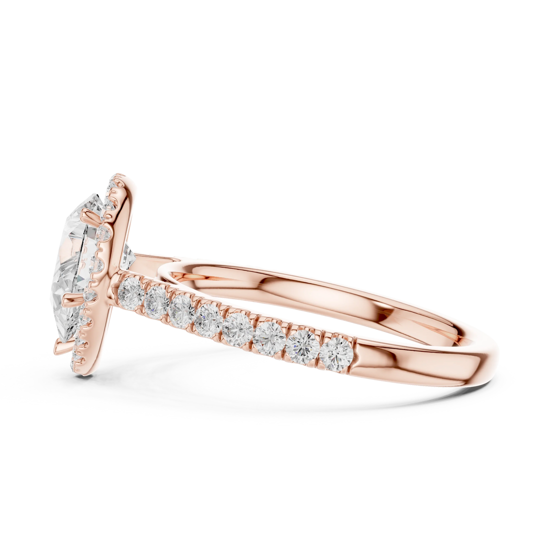 Side view of rose gold pear cut diamond ring with halo setting showcasing elegant band and elevated center stone