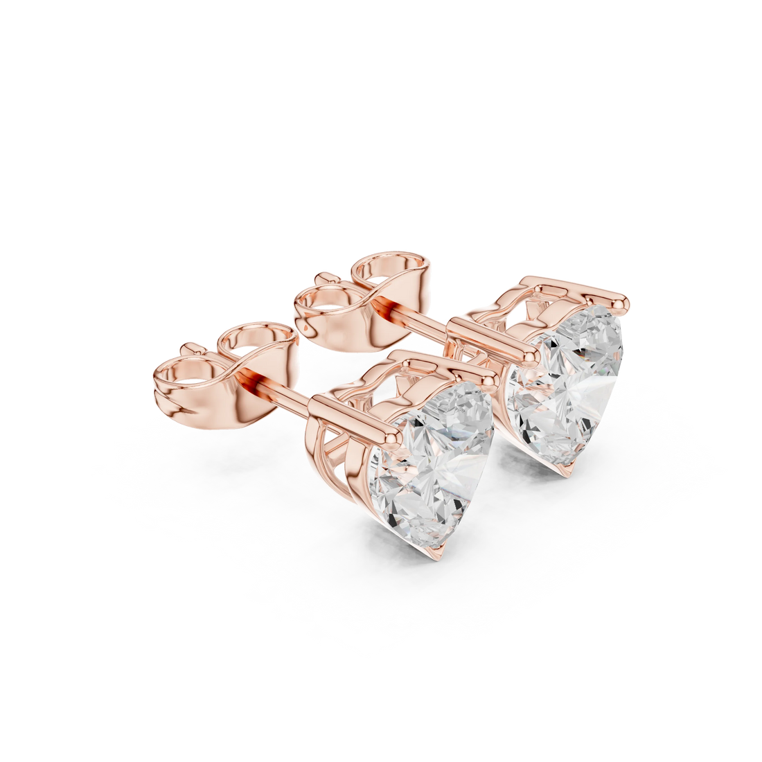 Rose gold earrings with clear gemstones on a white background from Top view