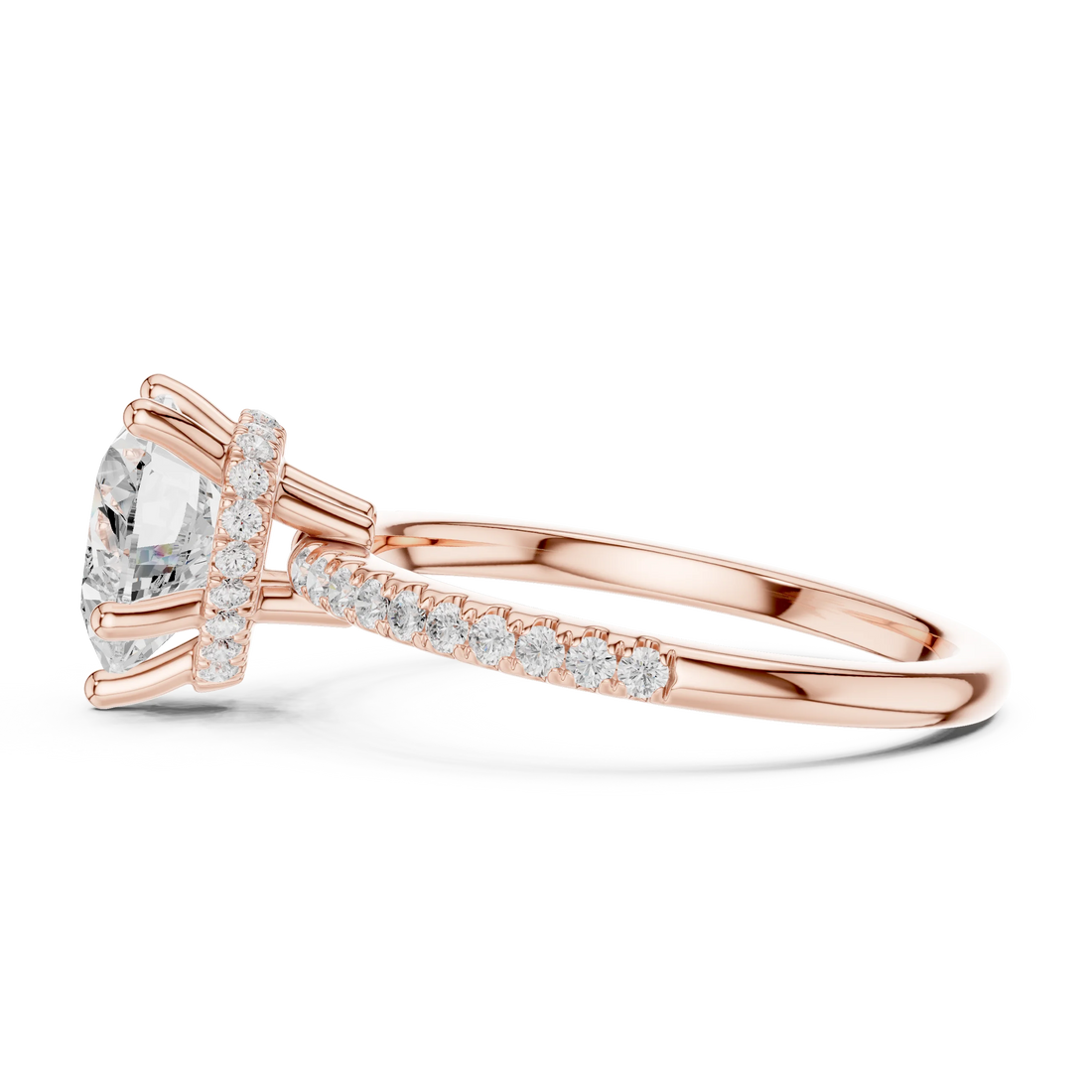 Side view of rose gold heart cut solitaire ring highlighting thin pave band and prong setting