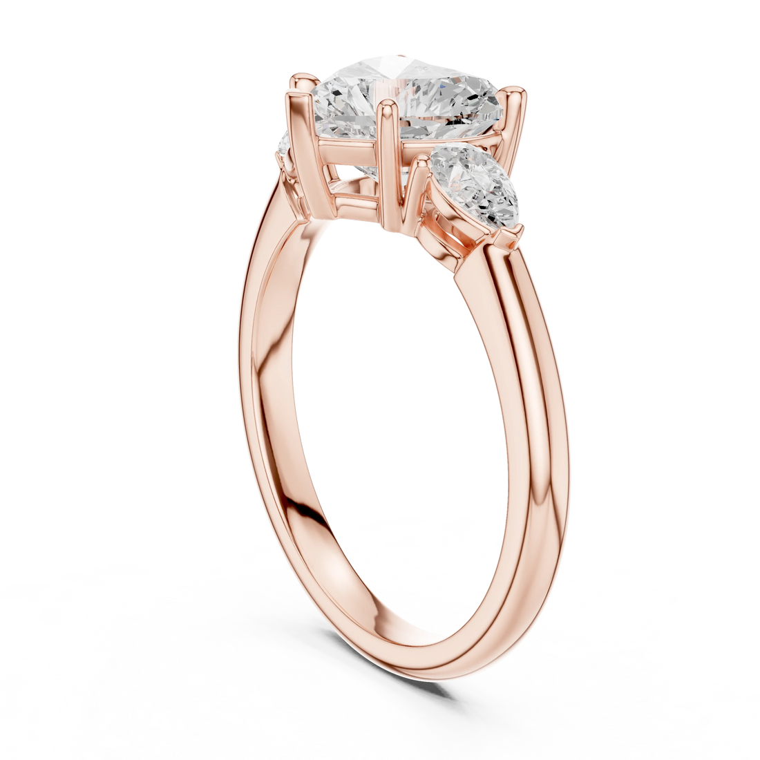 Front view of rose gold heart three-stone ring with pear side stones and lab-grown diamond – Australia