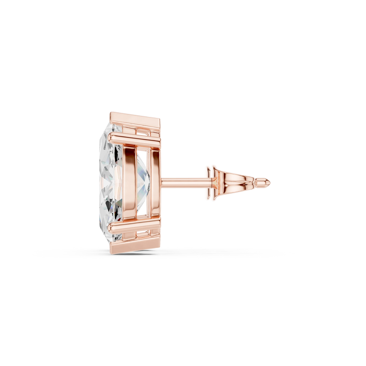 Rose gold earring with clear gemstone on a white background in side view