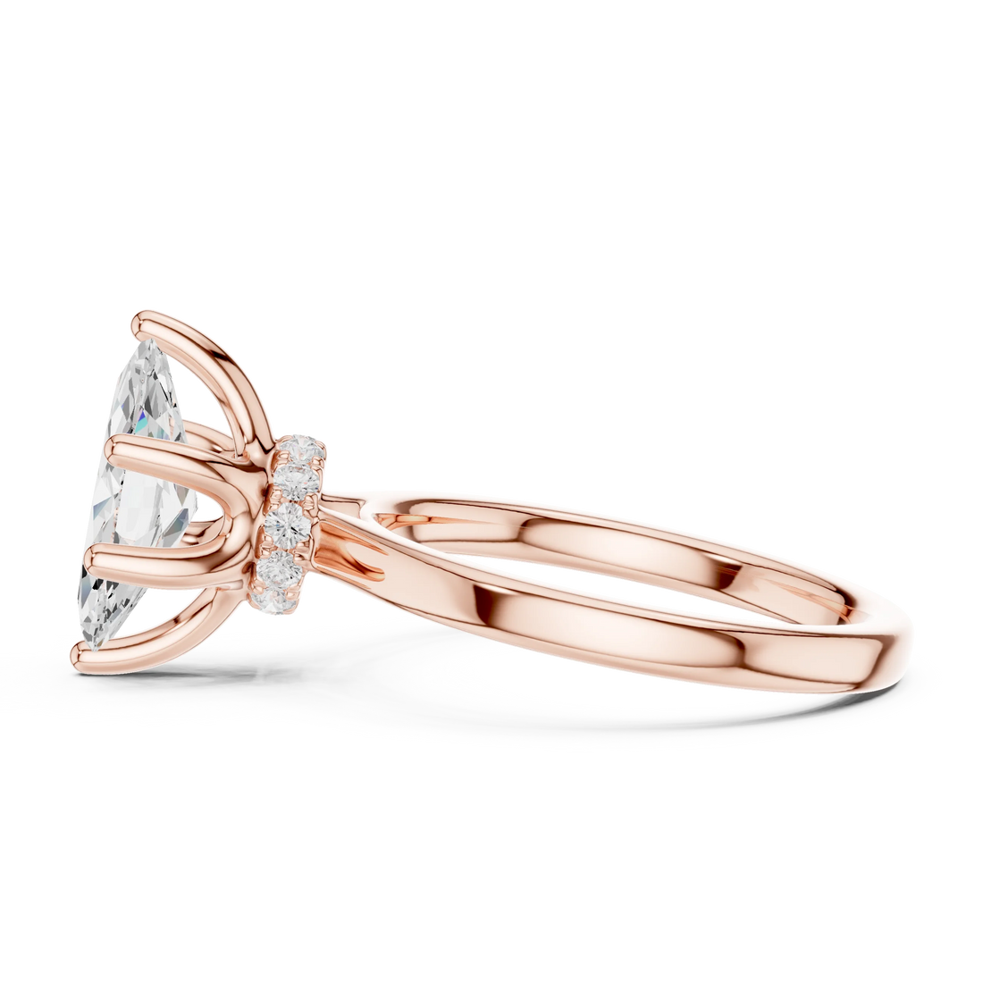 Side view of rose gold marquise cut solitaire ring highlighting hidden halo and domed band design