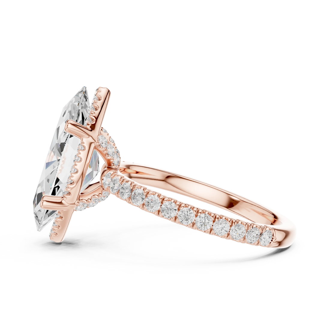 Side view of rose gold marquise cut solitaire ring highlighting hidden halo and thin pavé band design