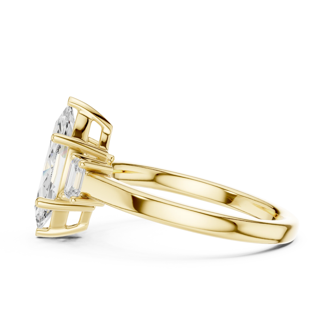 Side profile of yellow gold marquise cut three stone diamond ring, highlighting stone arrangement.