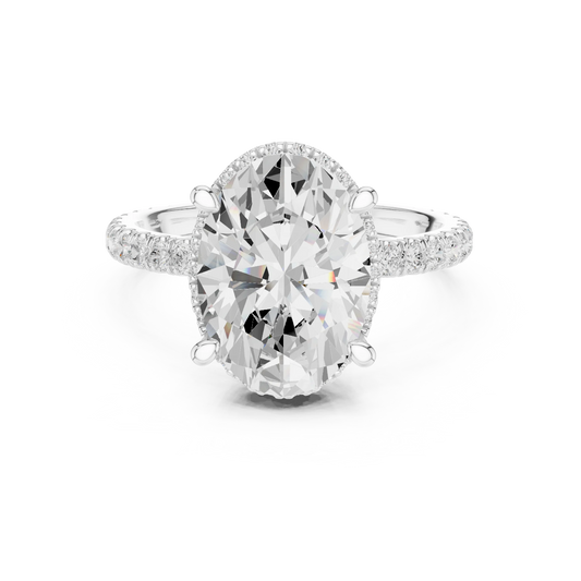 White gold oval cut solitaire ring with hidden halo and thin pavé band featuring lab-grown diamond, elegant design