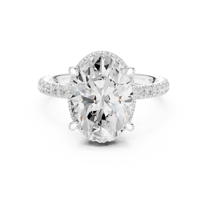 White gold oval cut solitaire ring with hidden halo and thin pavé band featuring lab-grown diamond, elegant design