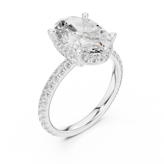 Front view of white gold oval cut solitaire ring with hidden halo and thin pavé diamond band and lab-created diamond