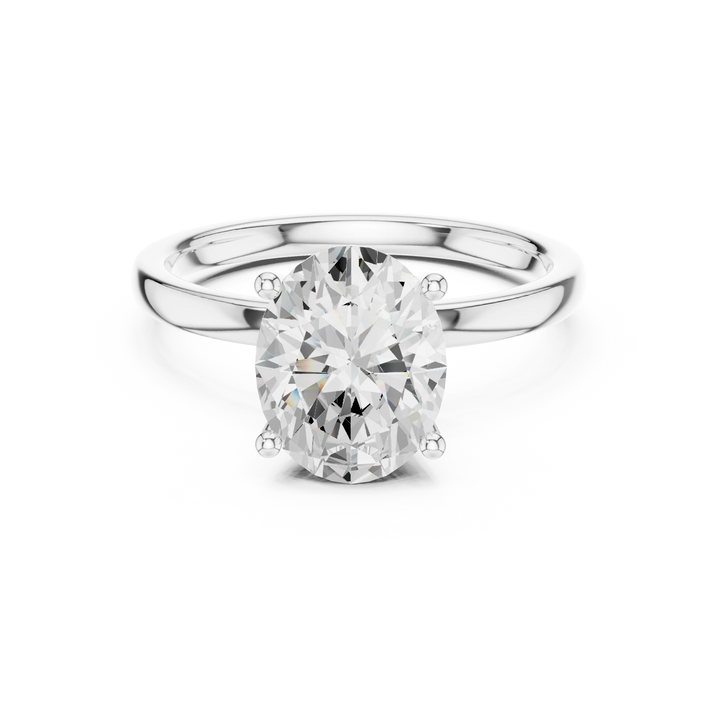 Lab-grown oval cut solitaire ring in white gold with plain domed band