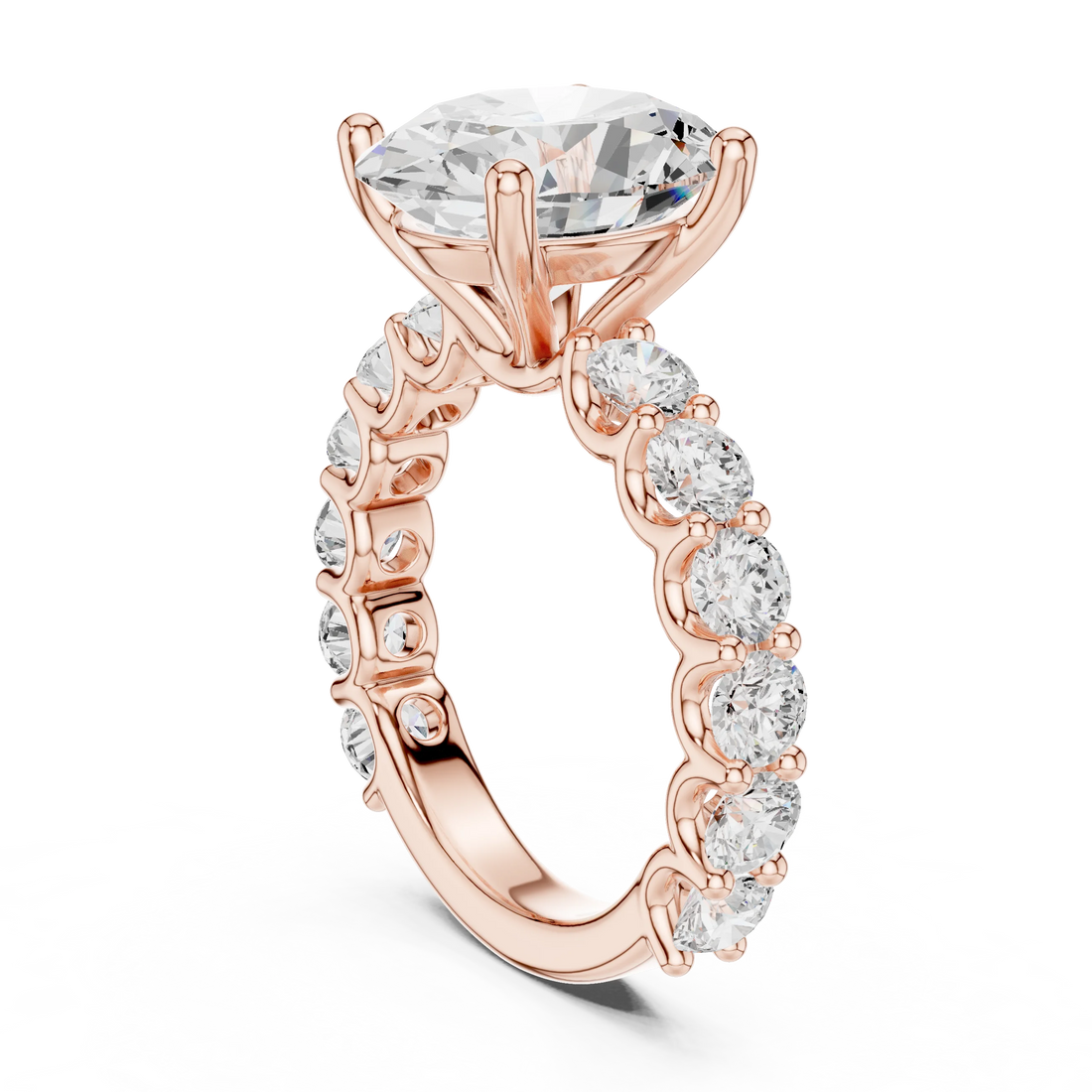 Back side view of rose gold oval cut solitaire ring showing shared prong large stone band and setting details