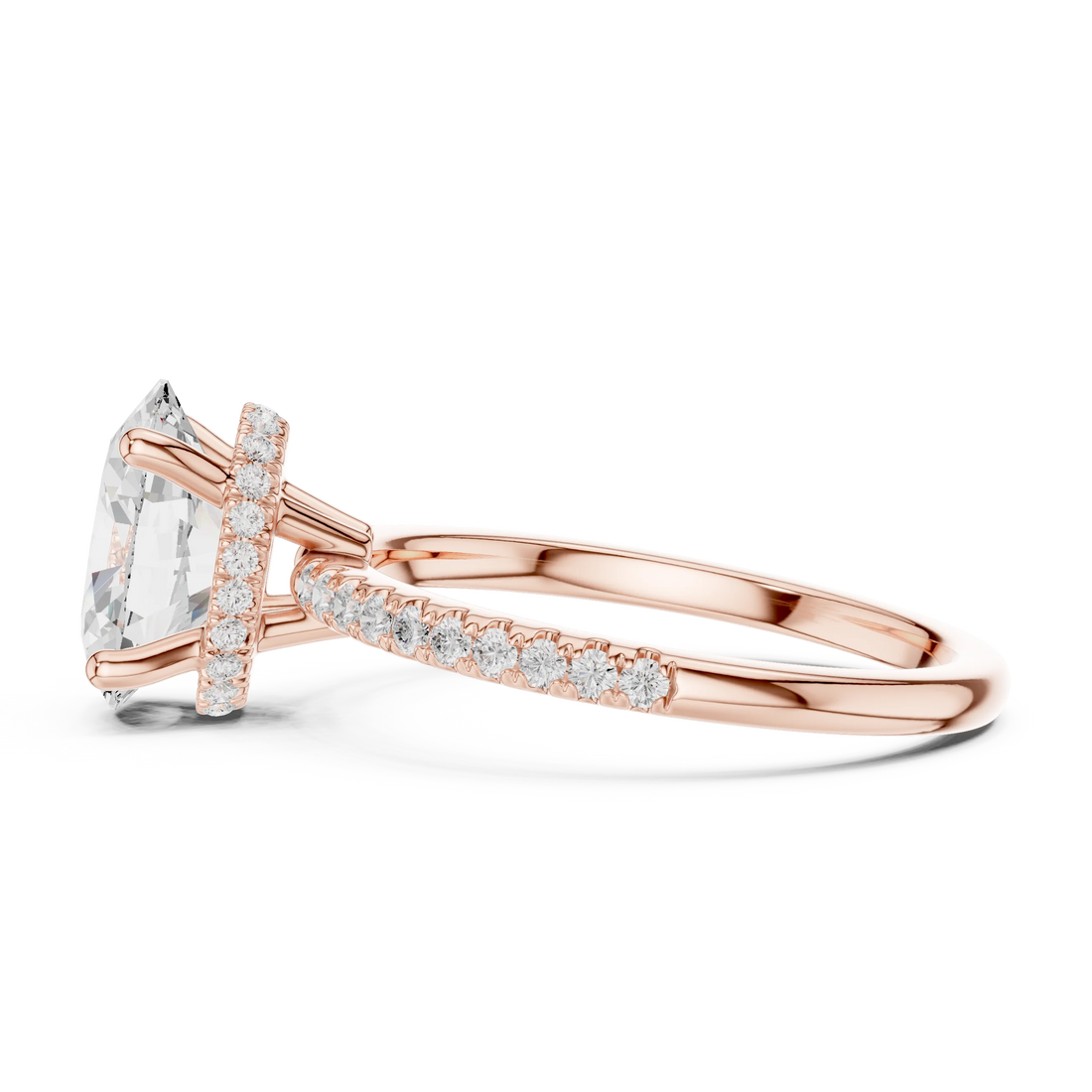 Side view of rose gold oval cut solitaire ring highlighting thin pave band and prong setting
