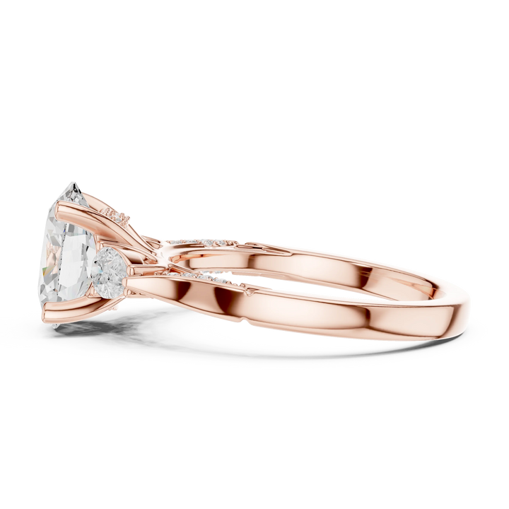 Side view of rose gold oval three stone ring with pear side stones, accent band and lab-grown diamonds – Australia